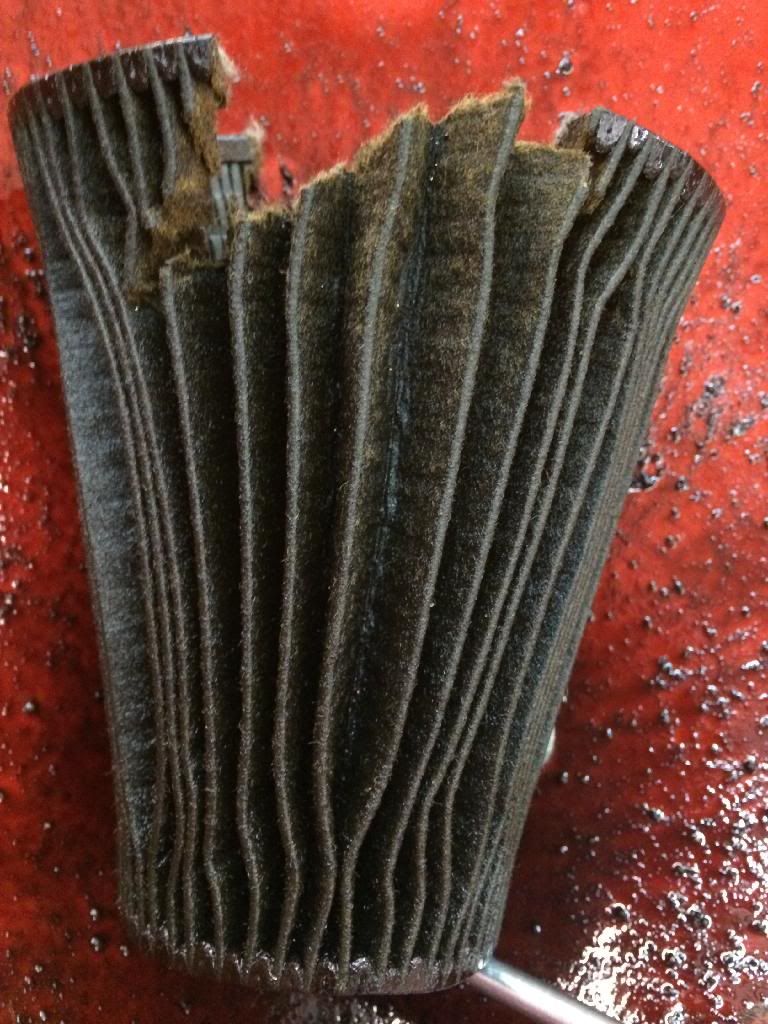 What is this METAL in my oil filter? And why is my oil SUPER BLACK? (pics)